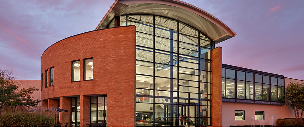 Website home page hero image front of the building