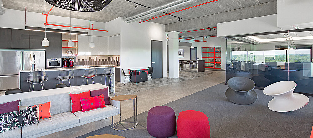 JLL Project Highlight: wide shot of kitchen and lounge area