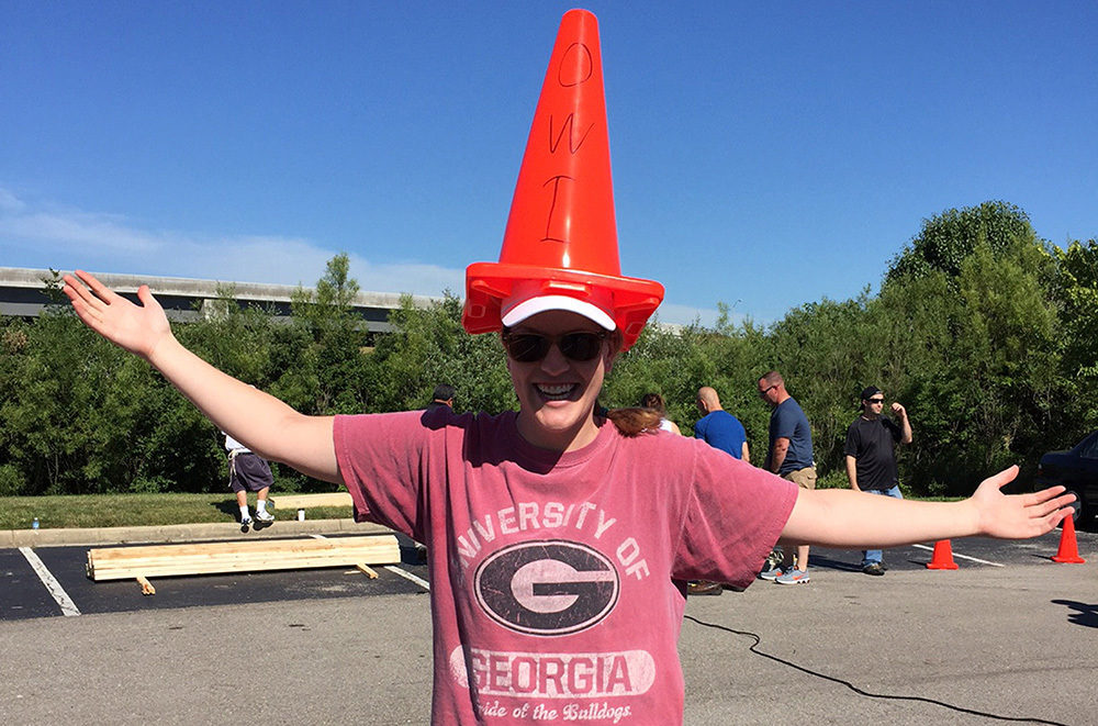 OW employee plays around during Habitat for Humanity Build with cone on his head