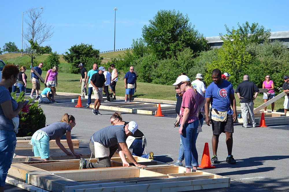 Far view of OW employees working during Habitat for Humanity Build