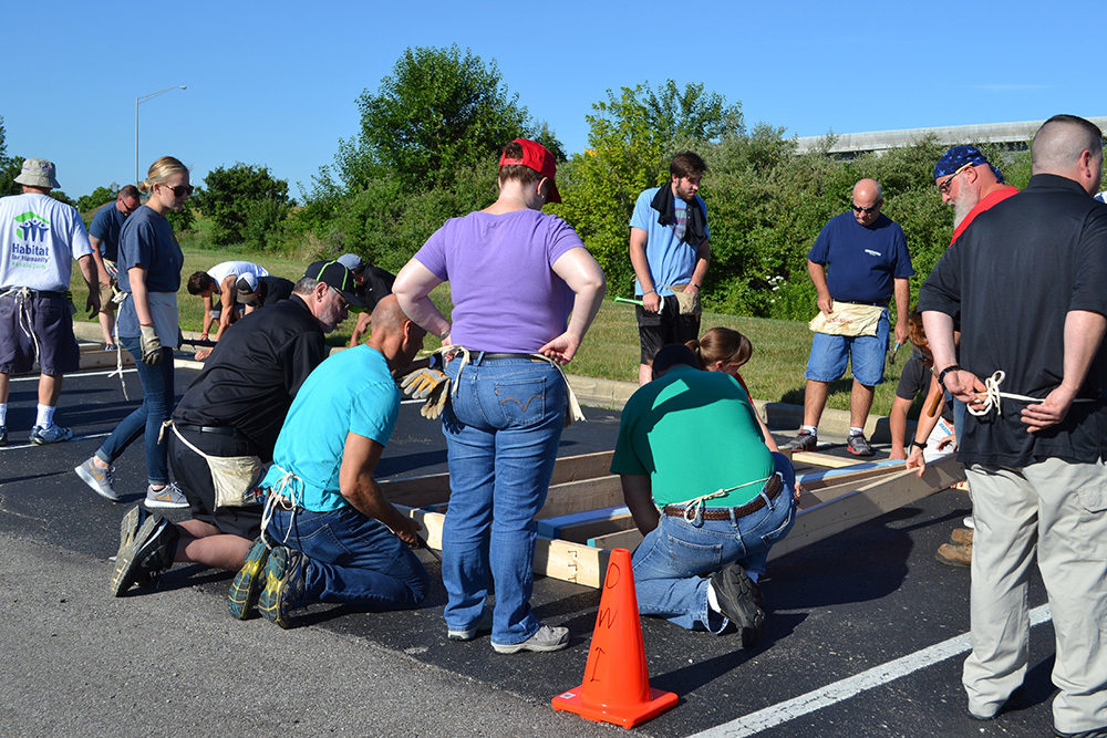 OW employees gather around project during Habitat for Humanity Build