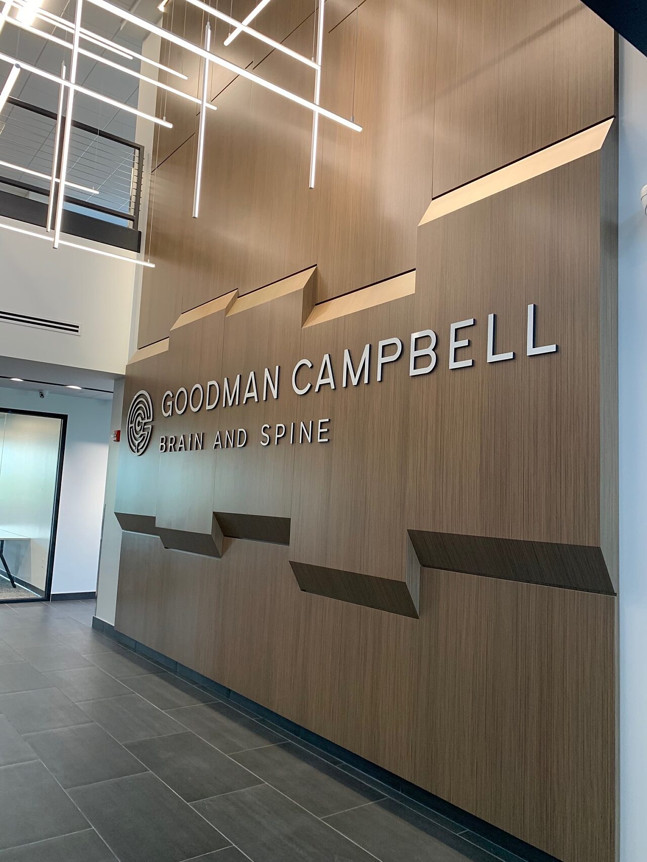 The large Goodman Campbell Brain and Spine center wall in the entryway of the office