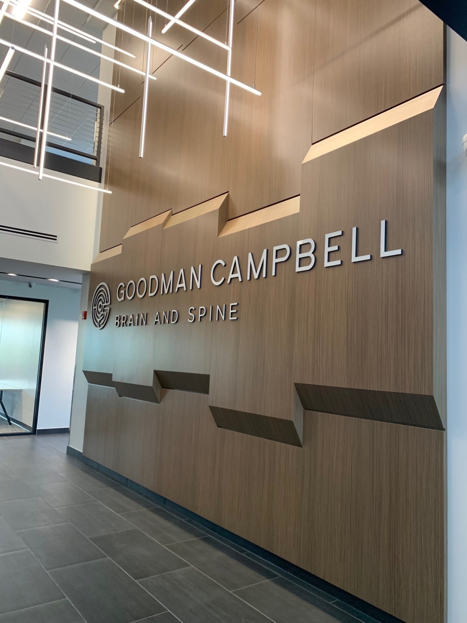 The large Goodman Campbell Brain and Spine center wall in the entryway of the office