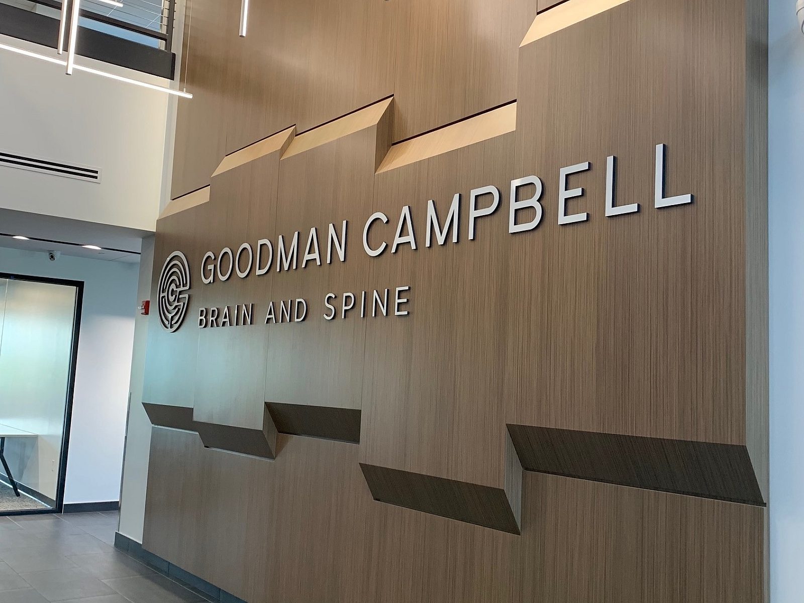 The large Goodman Campbell Brain and Spine center wall in the entryway of the office