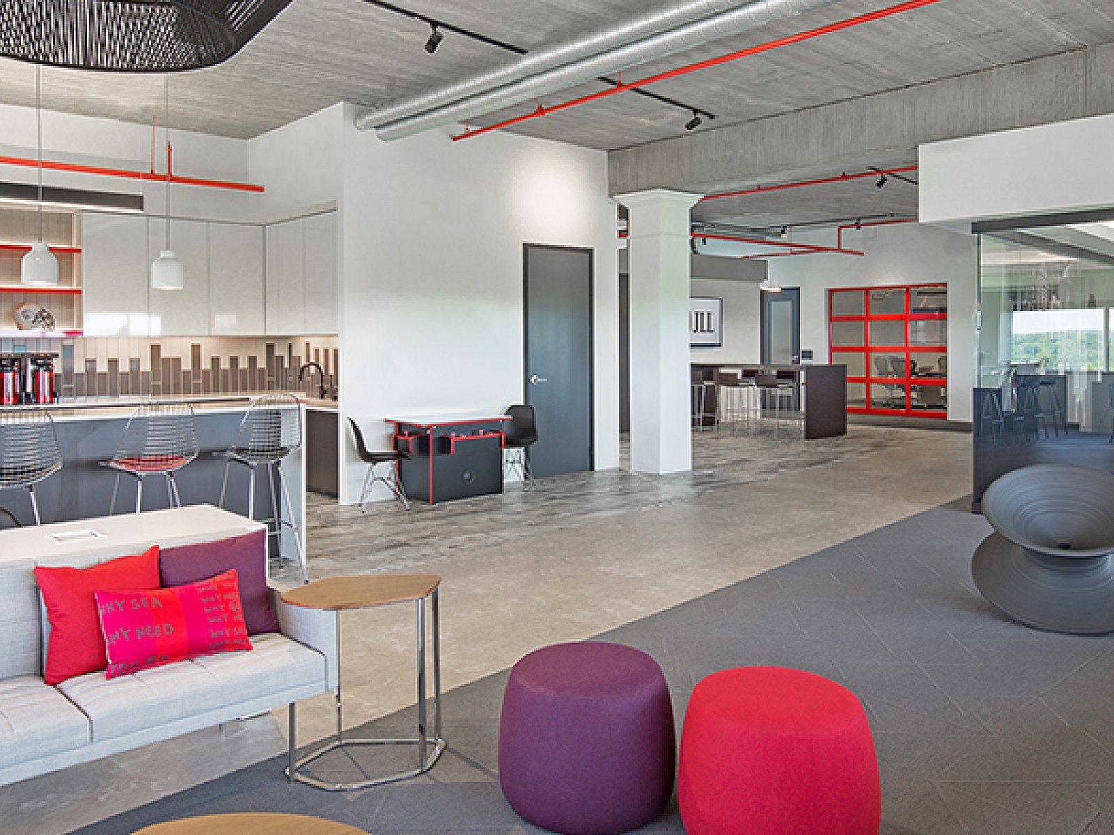 JLL Project Highlight: wide shot of kitchen and lounge area