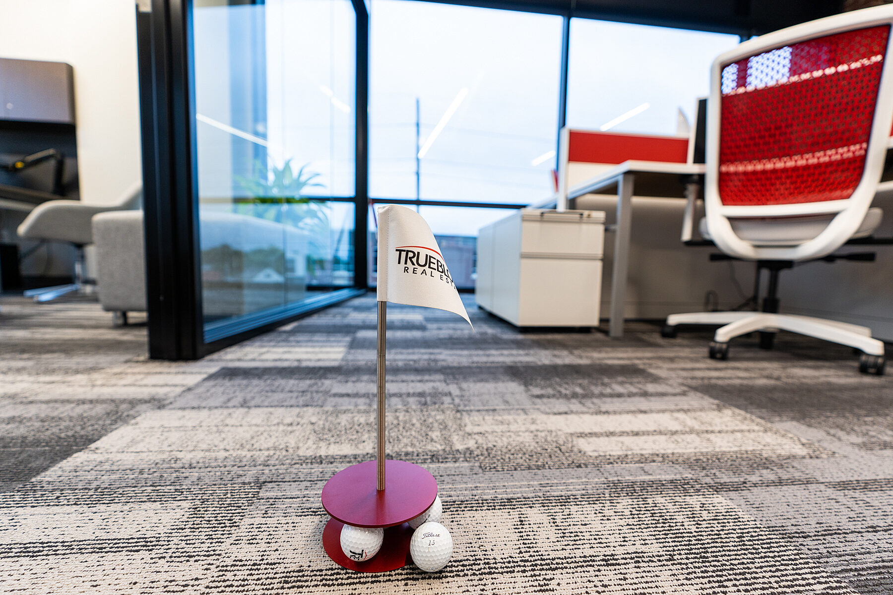 Trueblood Real Estate golf putting game in new office provided by OfficeWorks