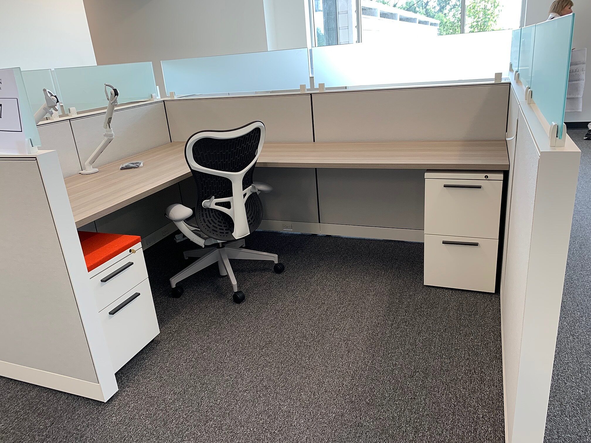 L-shaped desk and chair with computer arm monitor at the Goodman Campbell Brain and Spine center