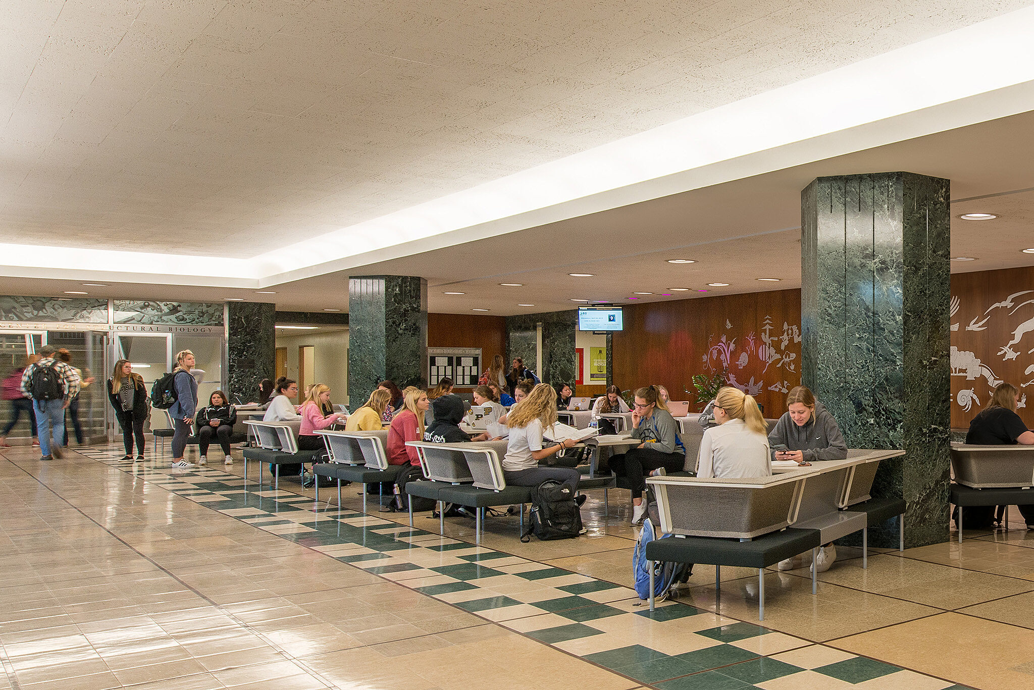 PULilly Project Highlight: full wide view of students studying at lobby tables
