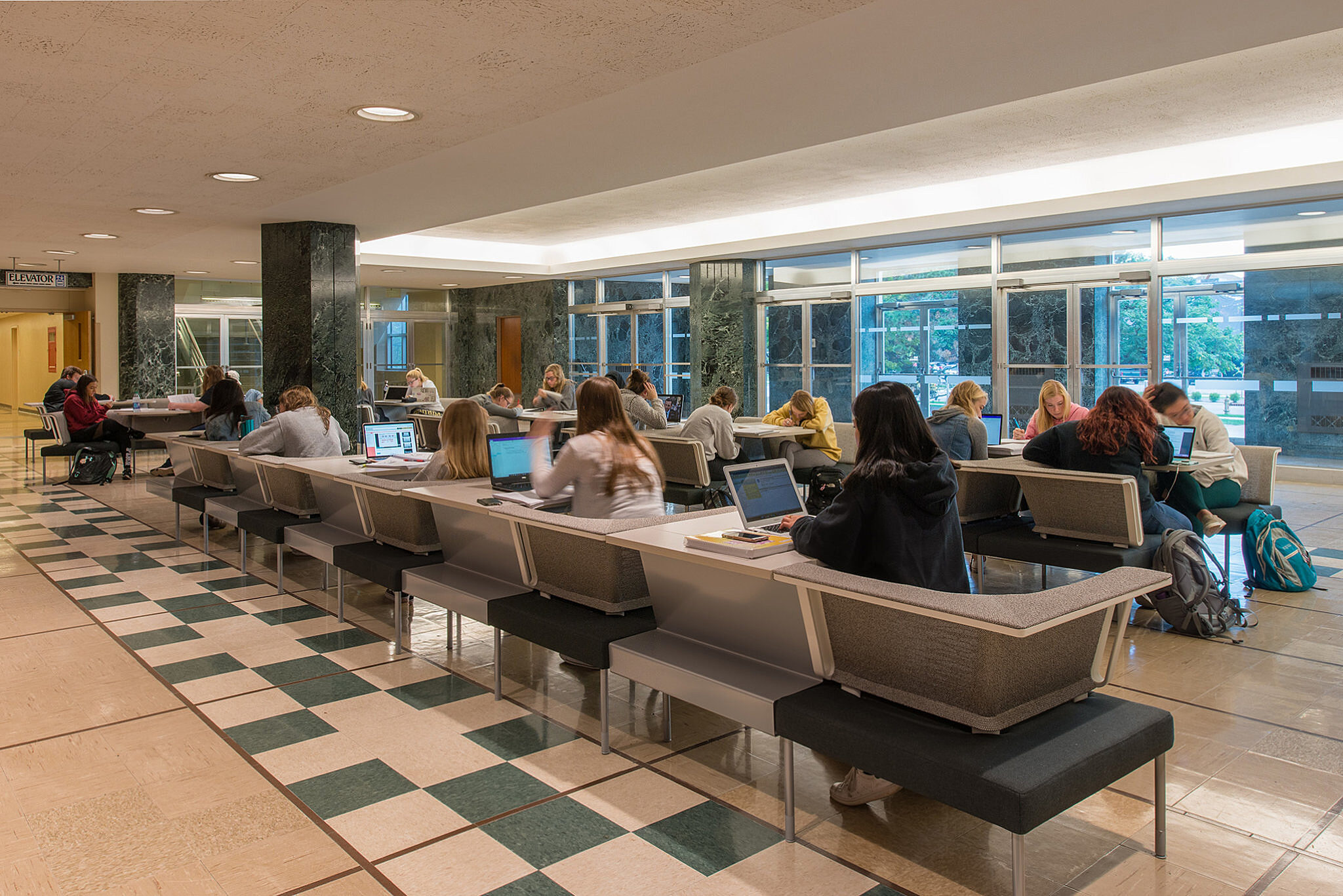 PULilly Project Highlight: back view of students studying at tables