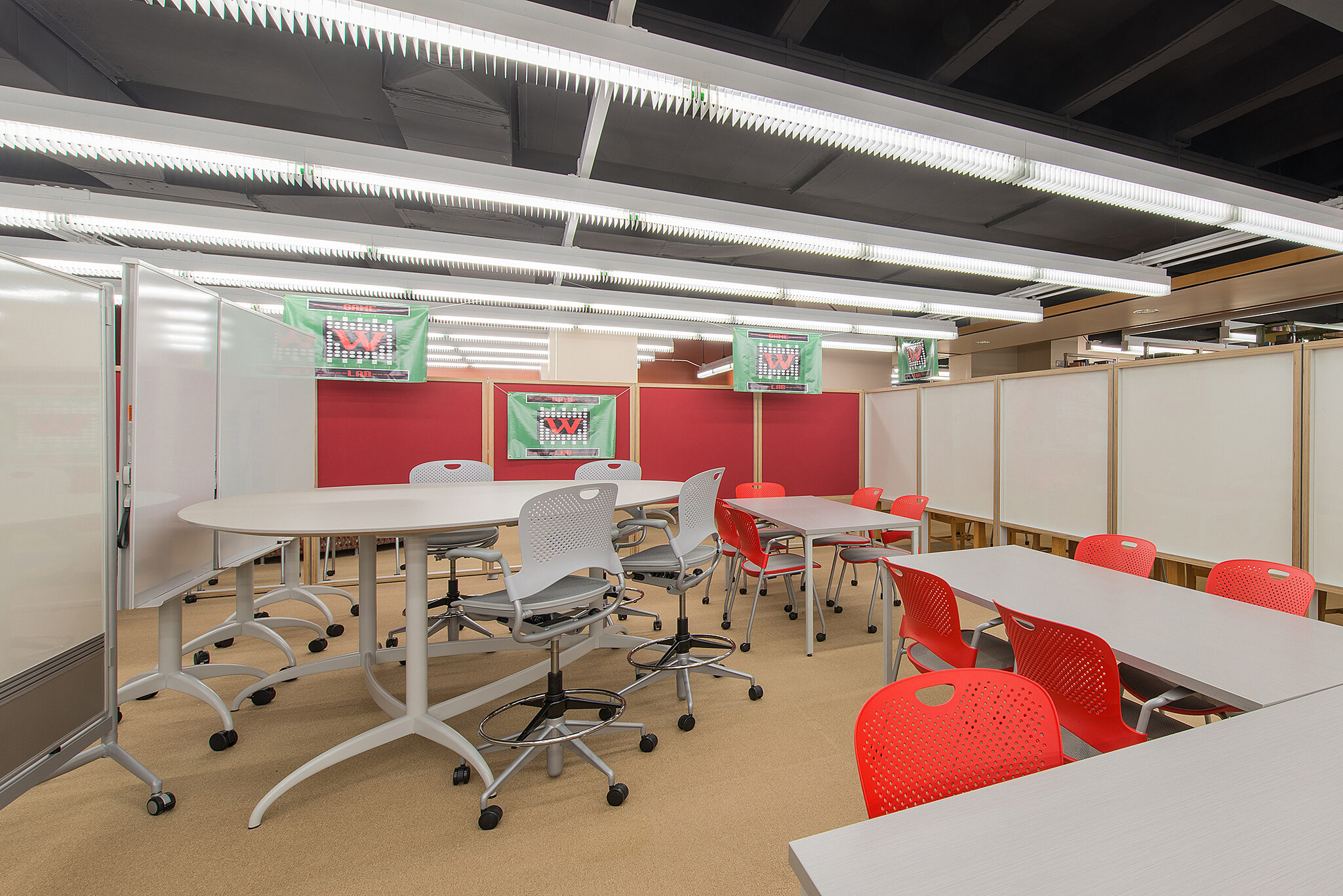 Wabash Project Highlight: tables chairs and whiteboard learning space side view