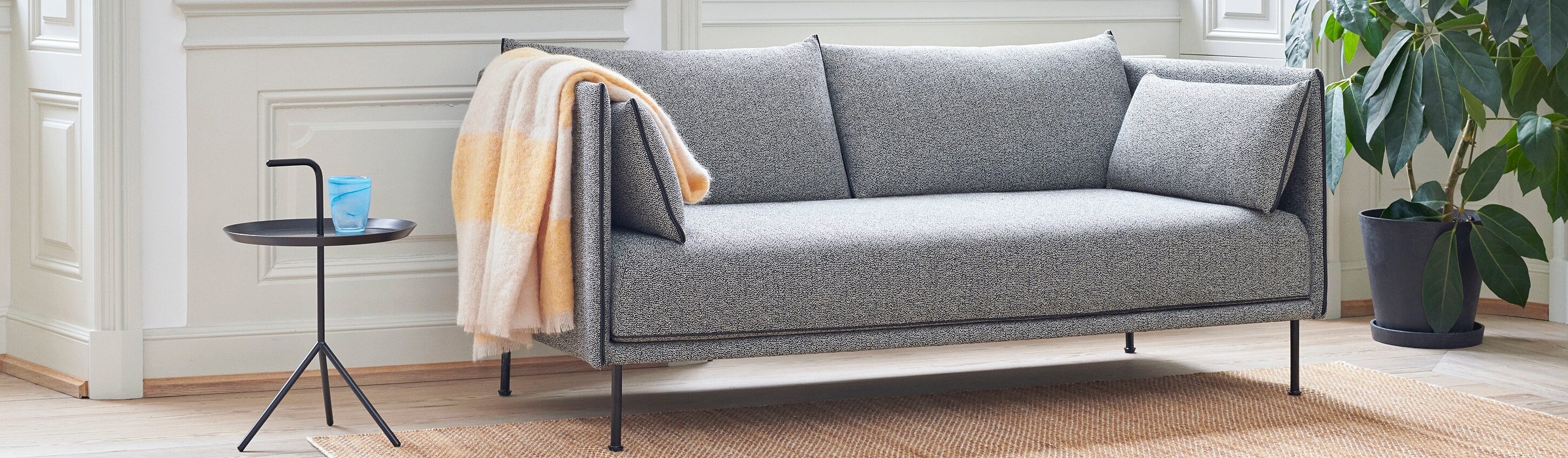 Furniture for Everyday Life grey couch with yellow blanket