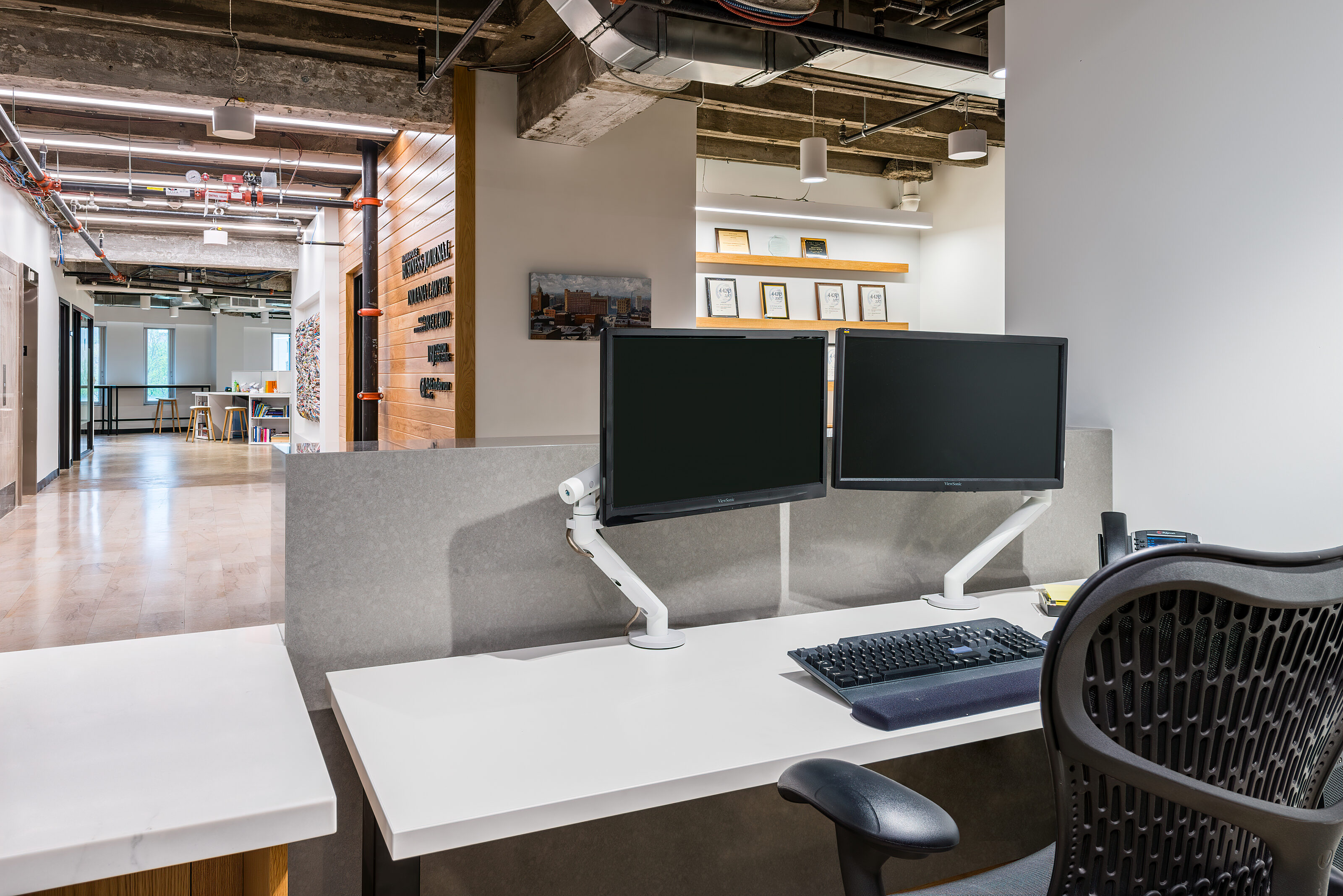 IBJ Project Highlight: desk setup with double monitors and view of hallway