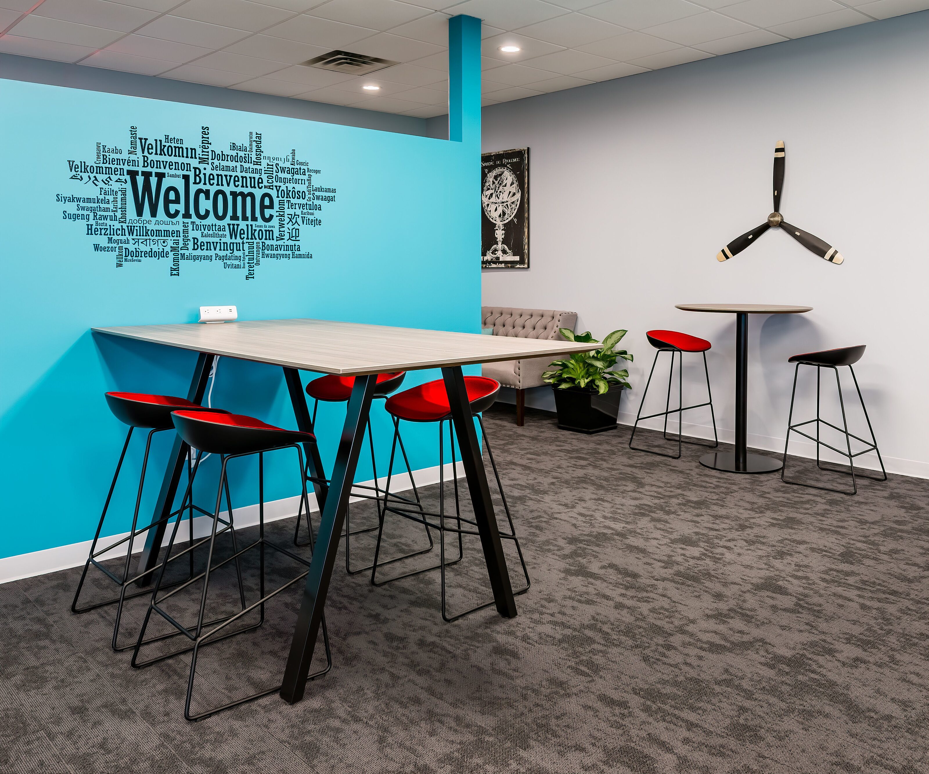 Travel Agent office renovation, high tables and welcome wall