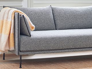 Furniture for Everyday Life grey couch with yellow blanket