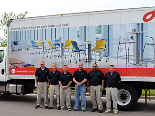 Instillation services hero image - truck with employees