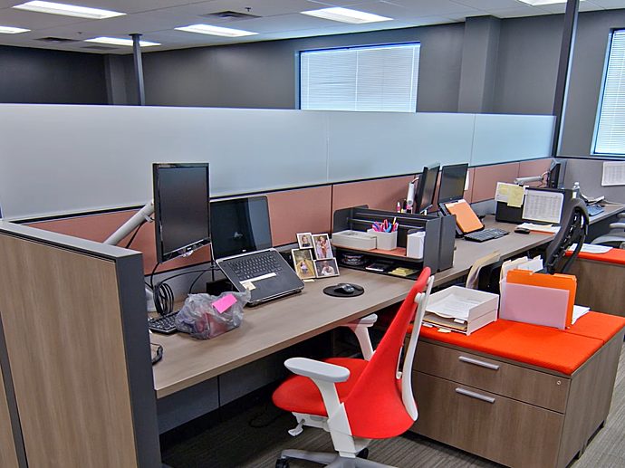 Desk set up with orange chairs